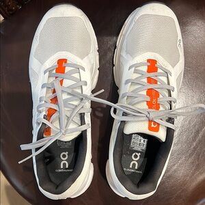 On Running White and Orange Sneakers